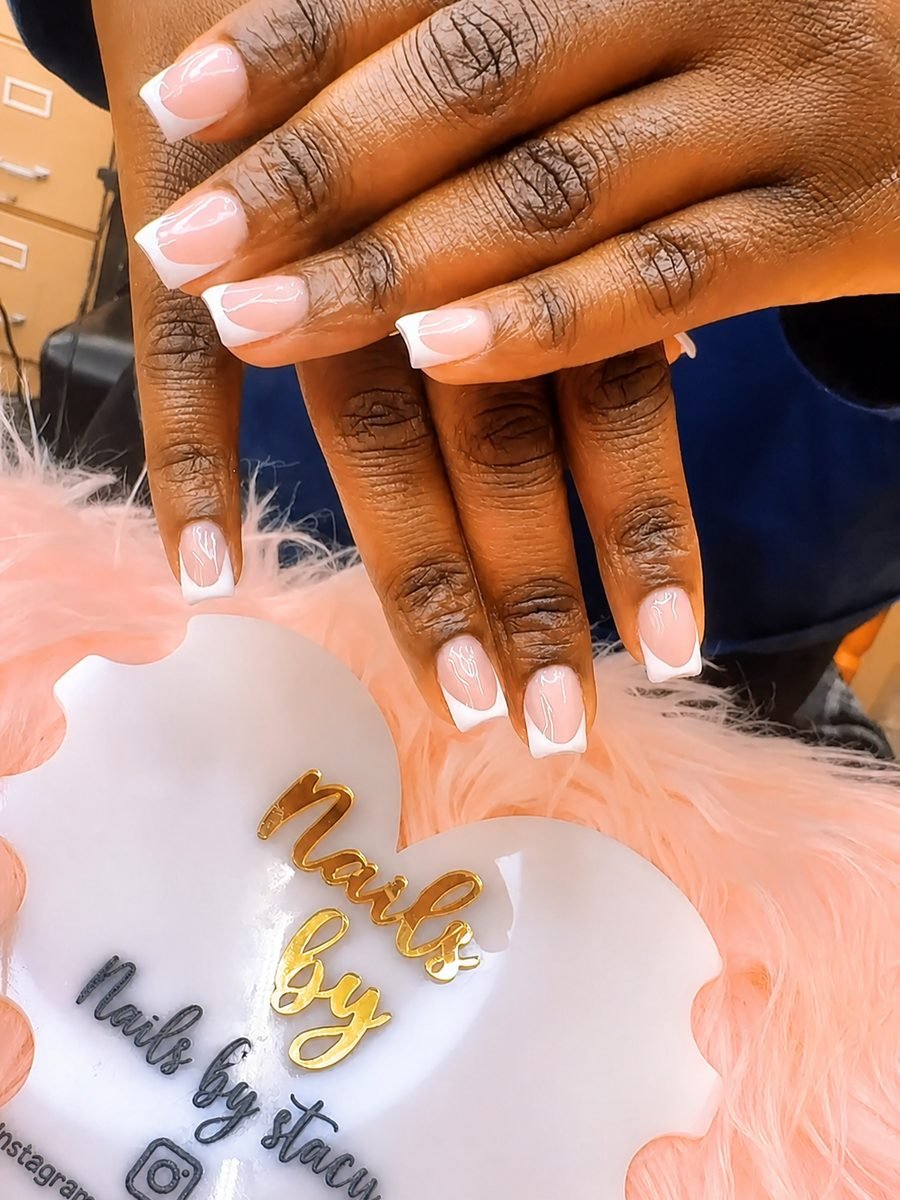 Glossy white French tip square nails on medium length